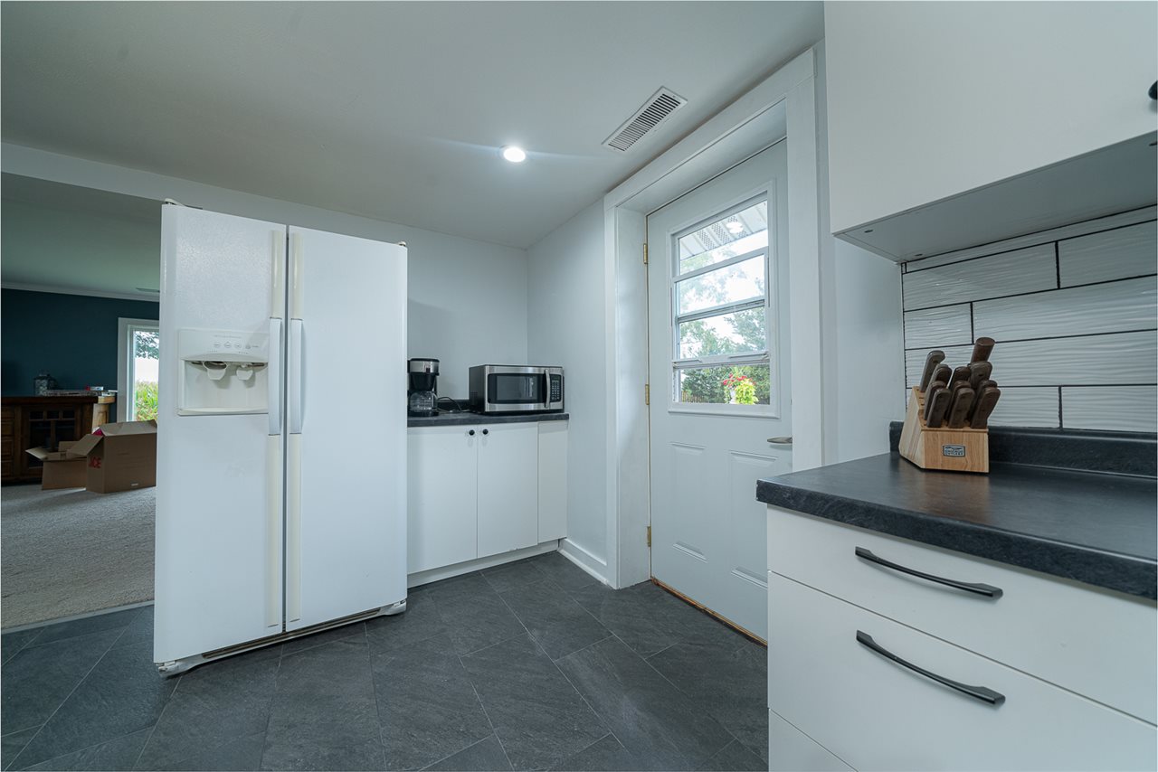 8424 South Main Street Rochelle, IL 61068 - Photo 12 of 26 a view of kitchen with furniture and refrigerator