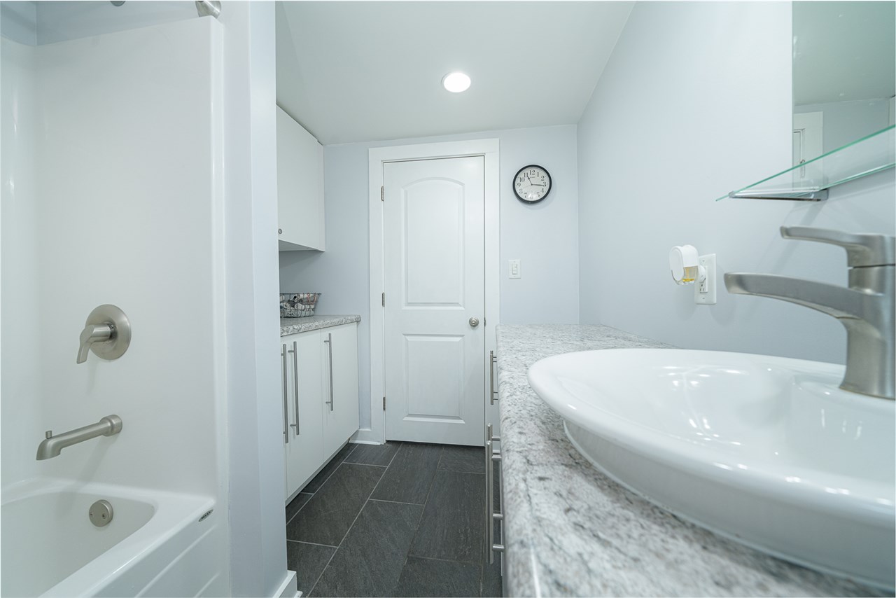 8424 South Main Street Rochelle, IL 61068 - Photo 18 of 26 a bathroom with a sink a toilet and shower