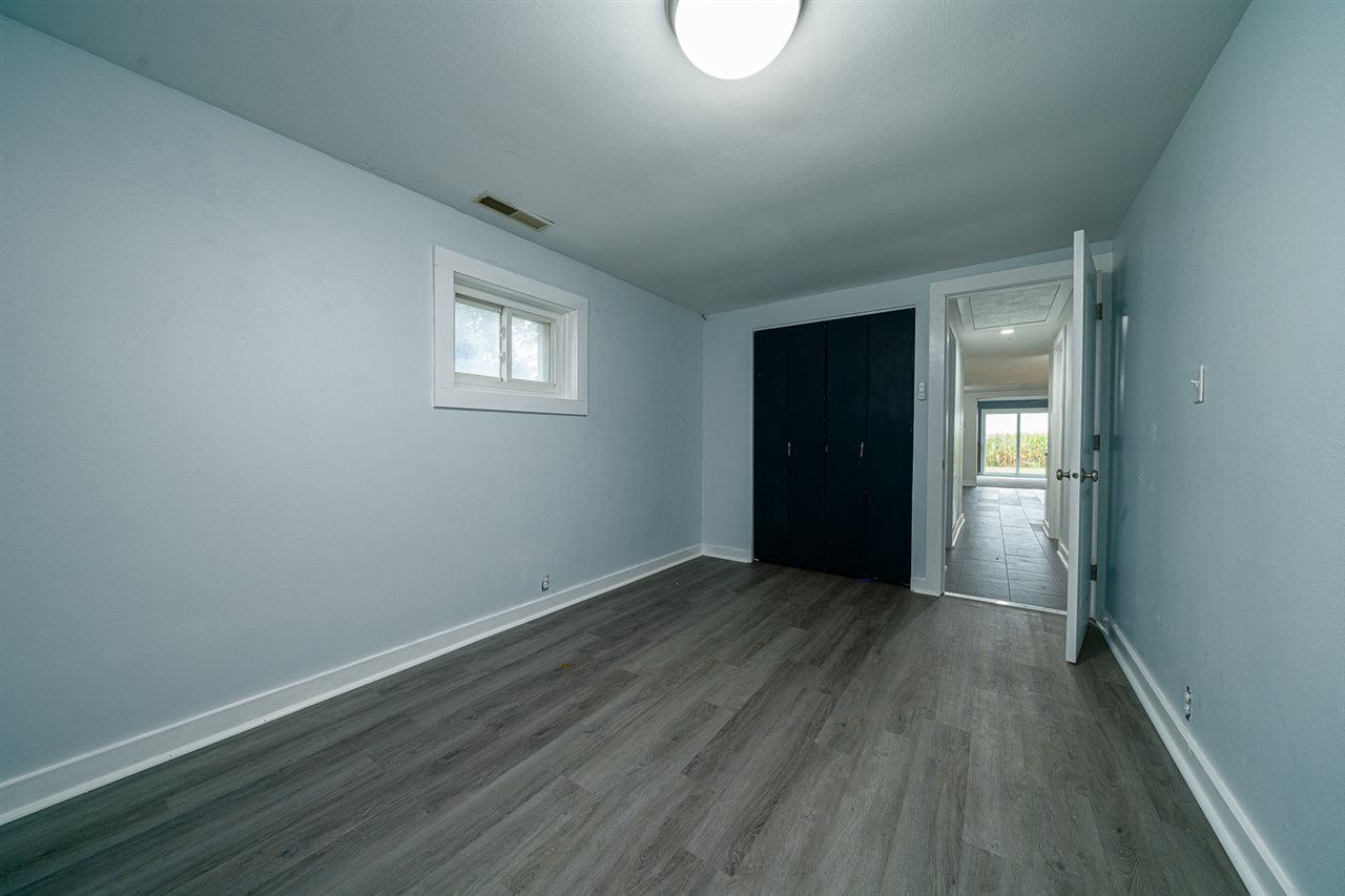 8424 South Main Street Rochelle, IL 61068 - Photo 22 of 26 a view of an empty room with wooden floor