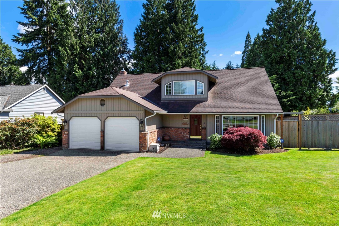 1508 243rd Place Southeast Bothell, WA 98021 - Photo 1 of 32 a front view of a house with garden