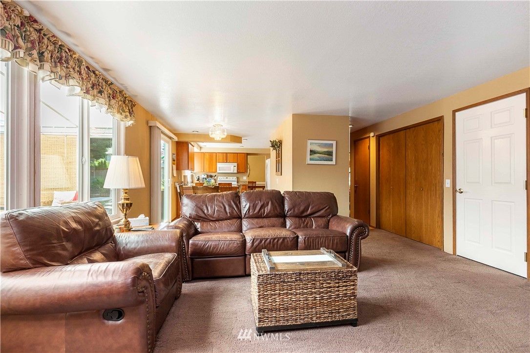 1508 243rd Place Southeast Bothell, WA 98021 - Photo 18 of 32 a living room with furniture and a window