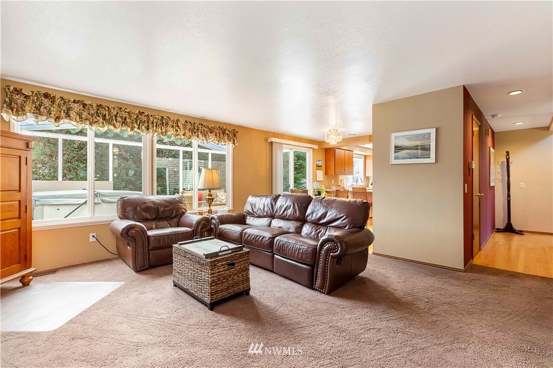 1508 243rd Place Southeast Bothell, WA 98021 - Photo 19 of 32 a living room with furniture and a large window
