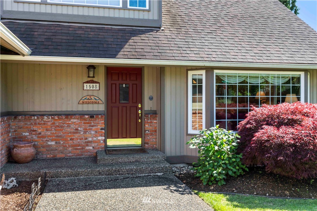 1508 243rd Place Southeast Bothell, WA 98021 - Photo 3 of 32 a view of a house with potted plants