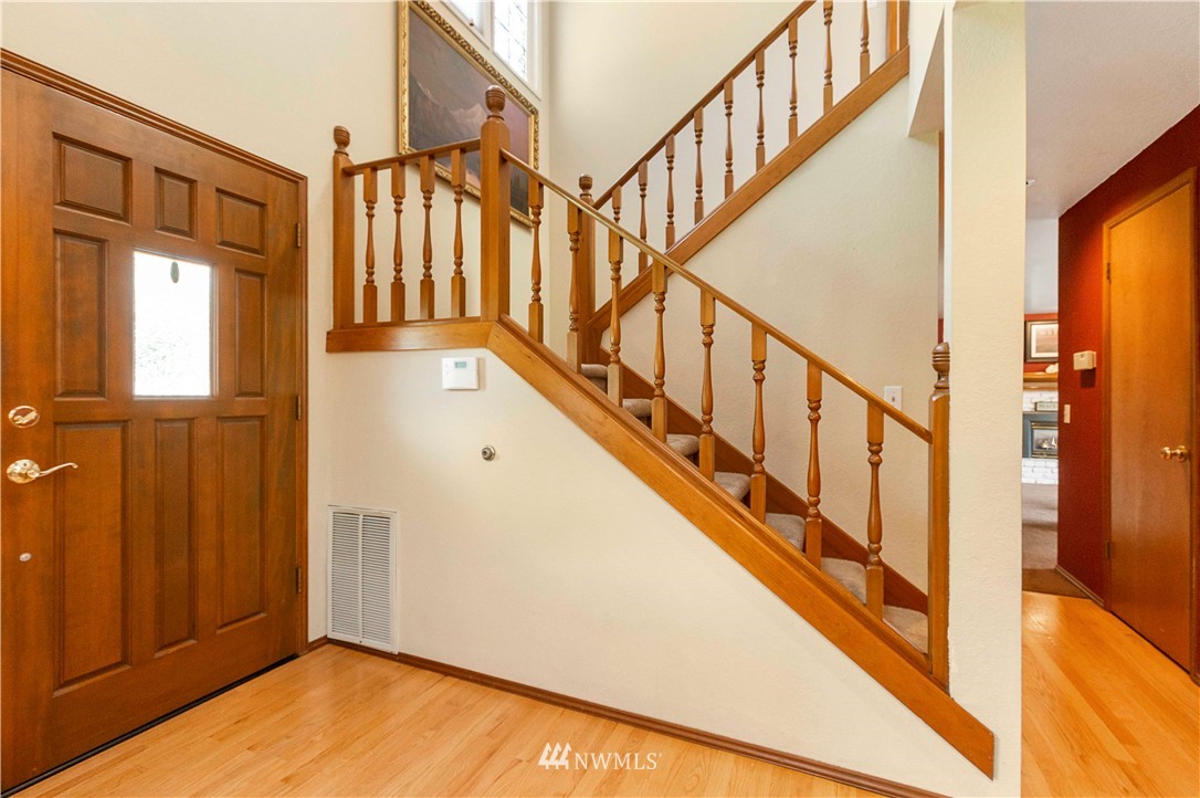 1508 243rd Place Southeast Bothell, WA 98021 - Photo 4 of 32 a view of an entryway with wooden floor