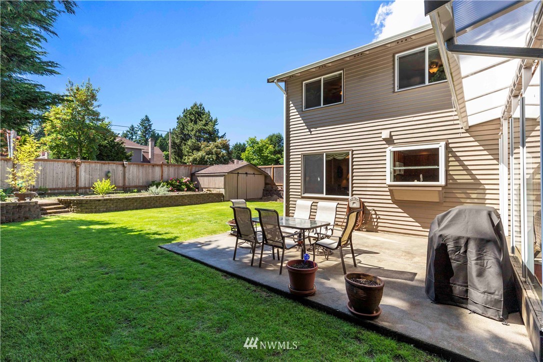 1508 243rd Place Southeast Bothell, WA 98021 - Photo 31 of 32 a view of a backyard with sitting area