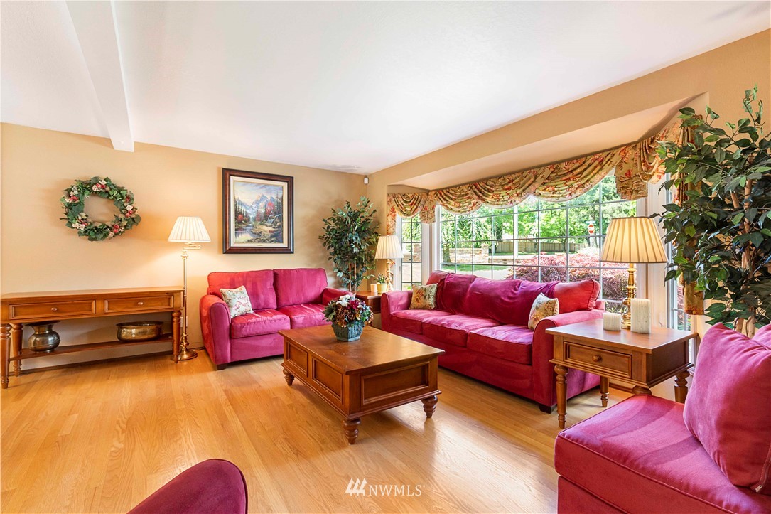 1508 243rd Place Southeast Bothell, WA 98021 - Photo 6 of 32 a living room with furniture a rug and a large window