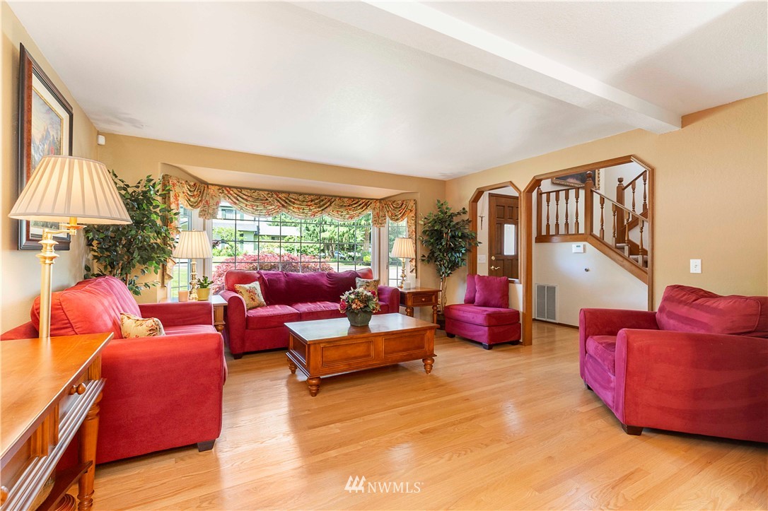 1508 243rd Place Southeast Bothell, WA 98021 - Photo 8 of 32 a living room with furniture and a large window