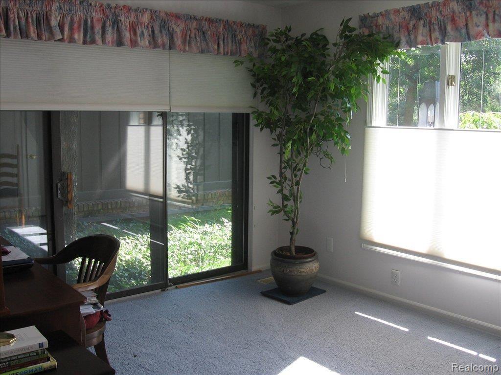1883 Wingate Road, Unit 1 Bloomfield Hills, MI 48302 - Photo 10 of 19 Master sitting room with patio v