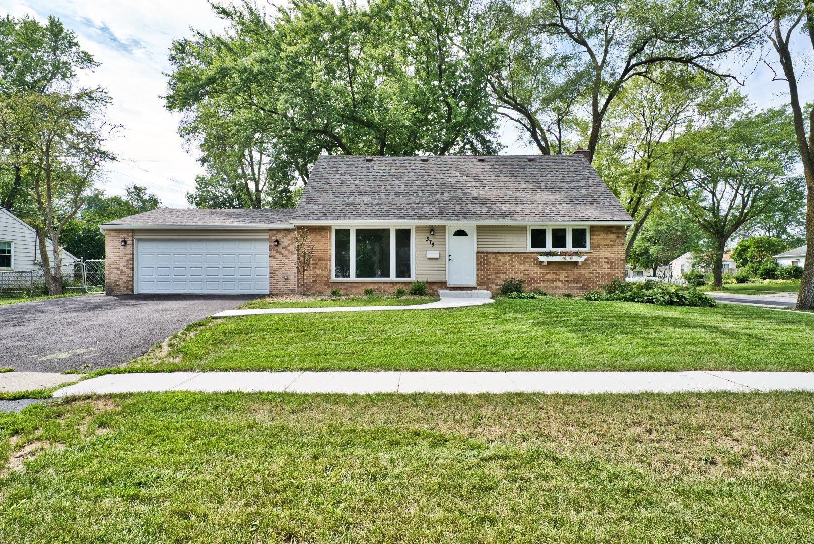 378 Glendale Road Buffalo Grove, IL 60089 - Photo 1 of 23 a front view of house with yard and green space