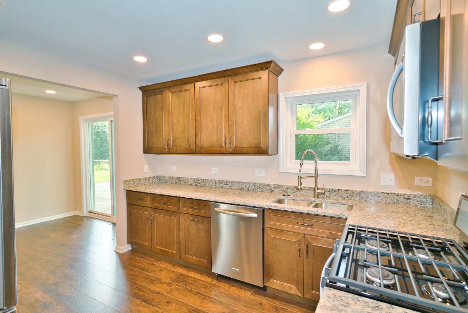 378 Glendale Road Buffalo Grove, IL 60089 - Photo 11 of 23 a kitchen with a sink stove and cabinets