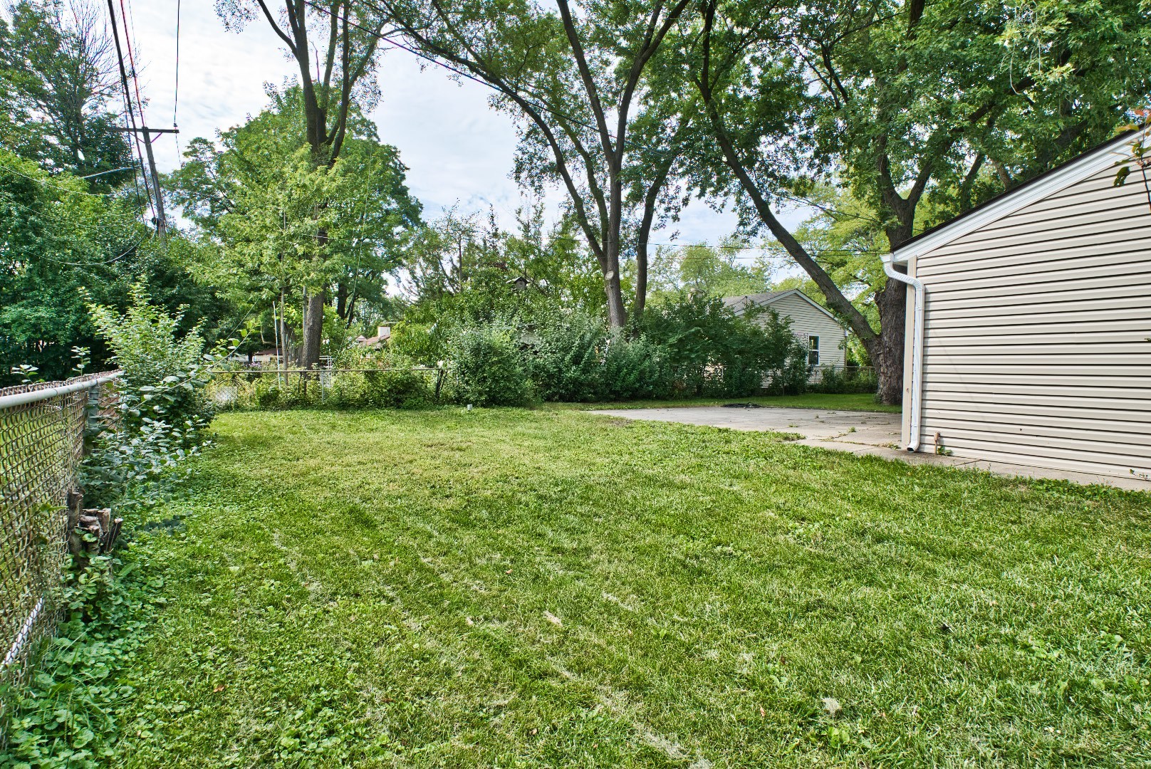 378 Glendale Road Buffalo Grove, IL 60089 - Photo 22 of 23 a view of a green field with trees in the background