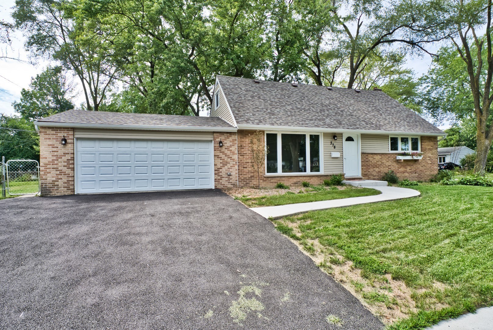 378 Glendale Road Buffalo Grove, IL 60089 - Photo 23 of 23 a front view of a house with a yard and garage