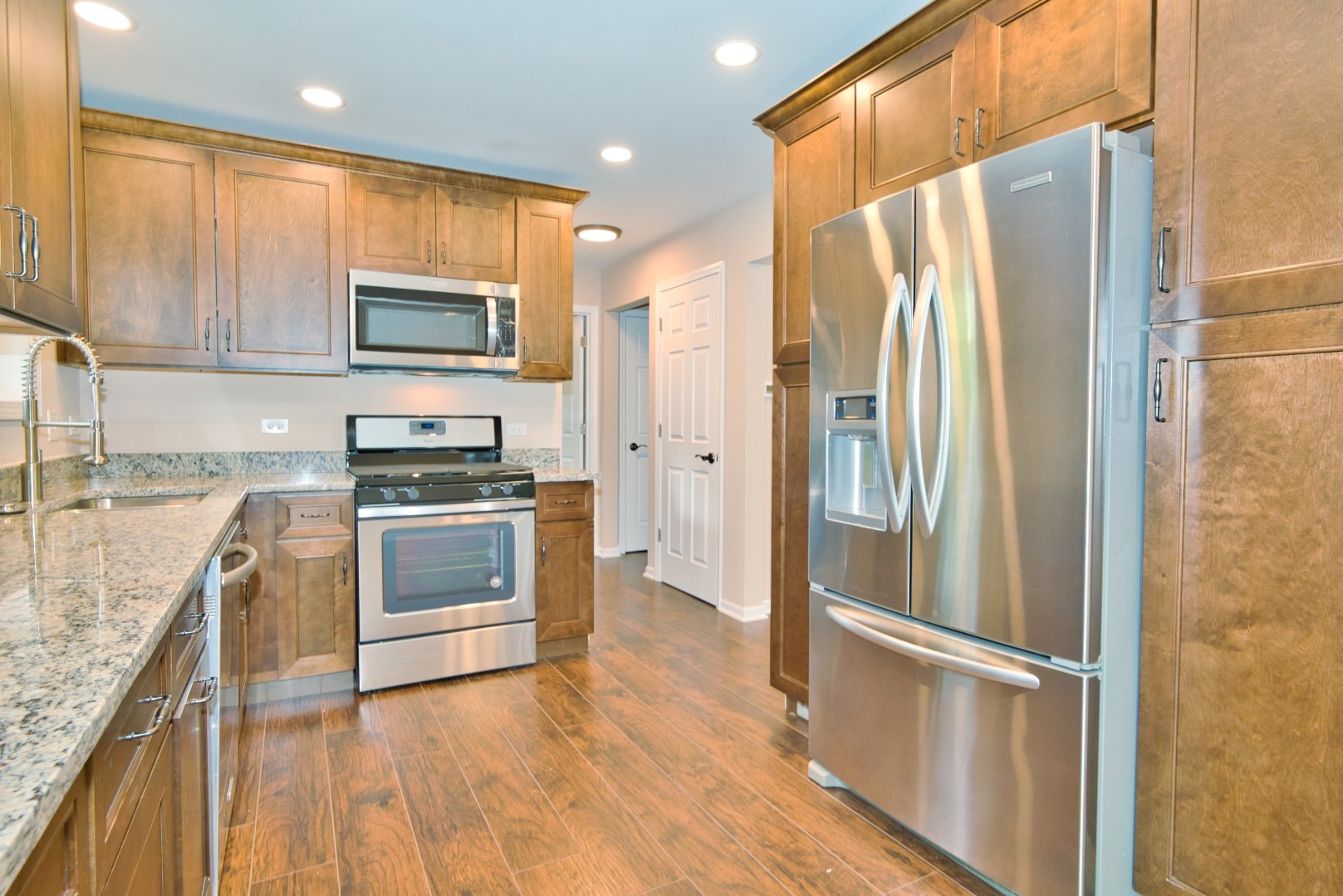 378 Glendale Road Buffalo Grove, IL 60089 - Photo 4 of 23 a kitchen with stainless steel appliances a refrigerator sink and microwave