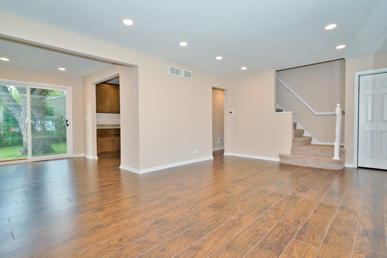 378 Glendale Road Buffalo Grove, IL 60089 - Photo 9 of 23 a view of empty room with wooden floor and fireplace