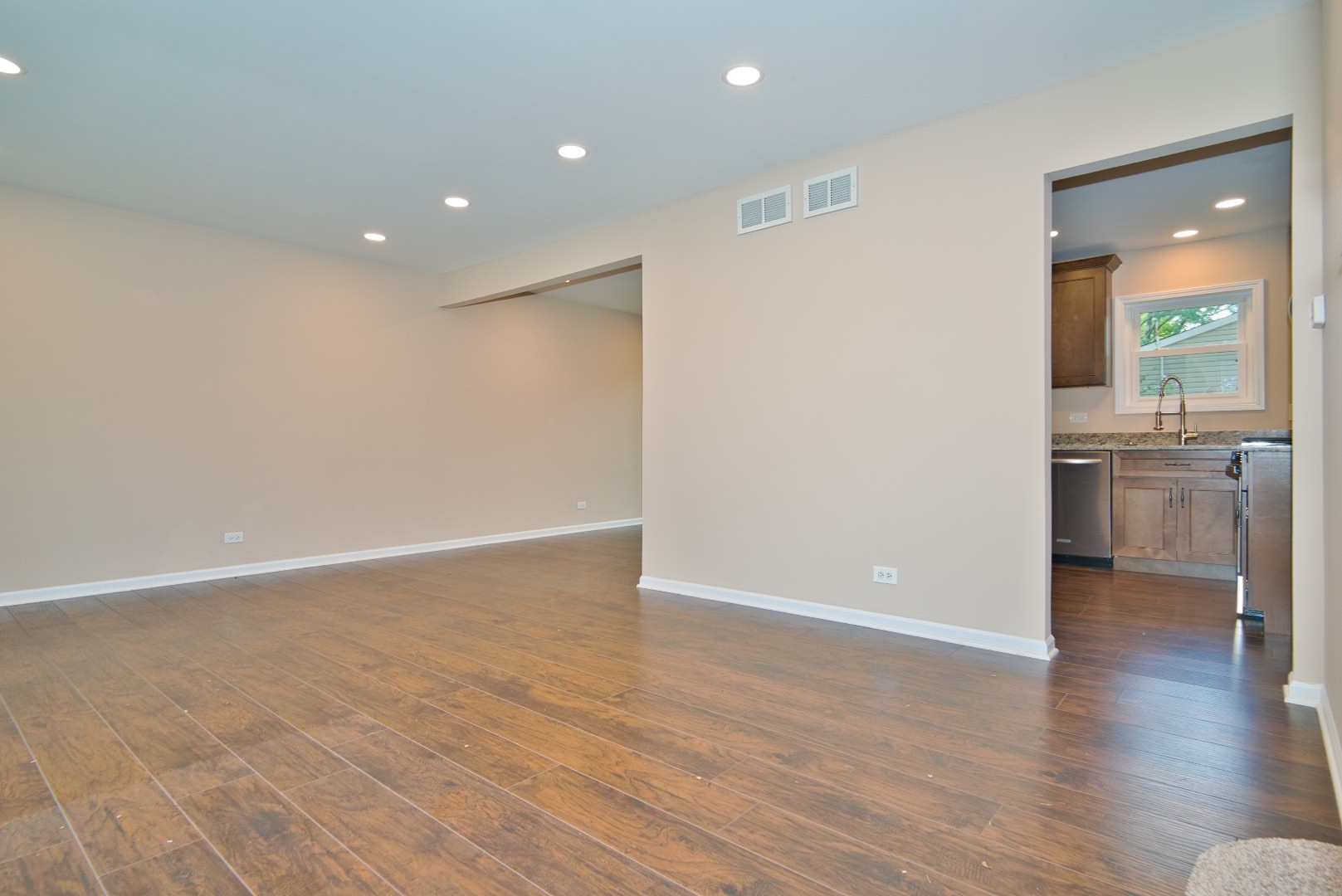 378 Glendale Road Buffalo Grove, IL 60089 - Photo 10 of 23 wooden floor in an empty room with a window