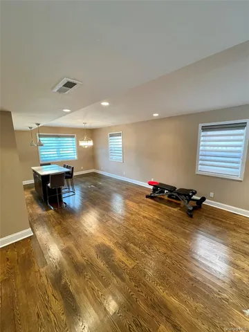 a kitchen with a stove a counter space a sink and cabinets