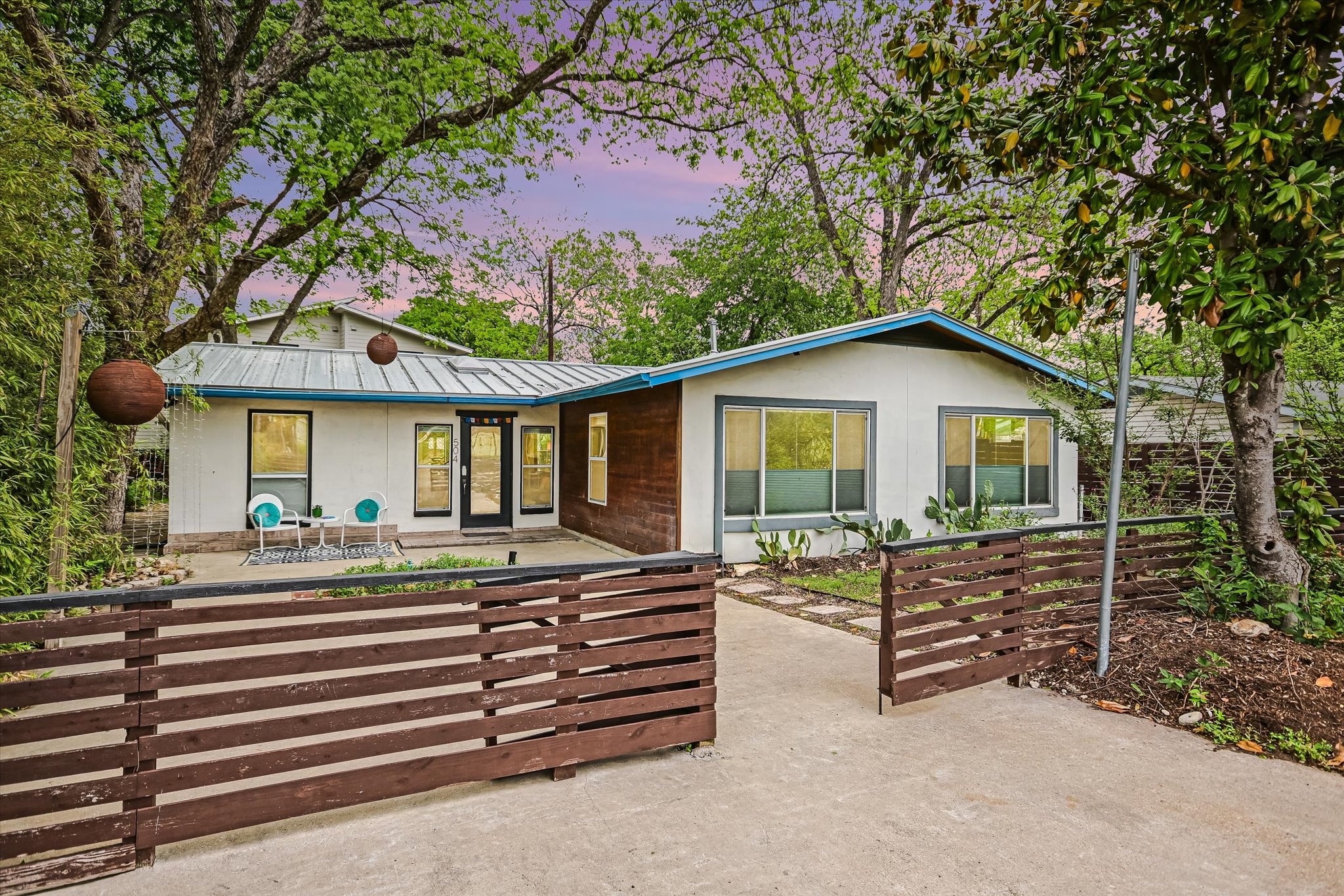 504 Powell Circle Austin, TX 78704 - Photo 1 of 23 a front view of house with a garden and patio