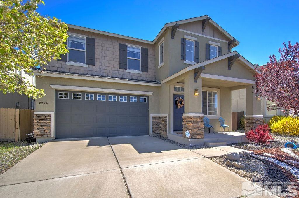 2275 Big Trail Circle Reno, NV 89521 - Photo 1 of 40 a front view of a house with a garage