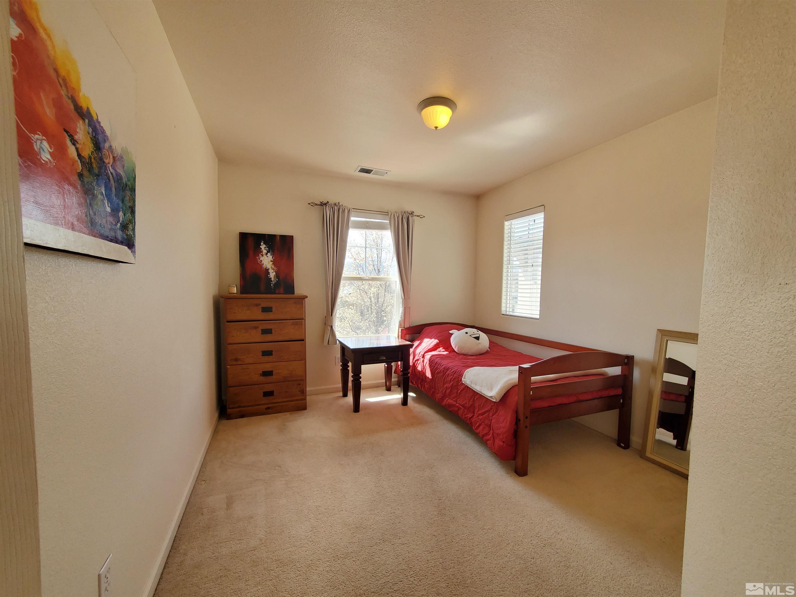 2275 Big Trail Circle Reno, NV 89521 - Photo 11 of 40 a bedroom with furniture and a bed