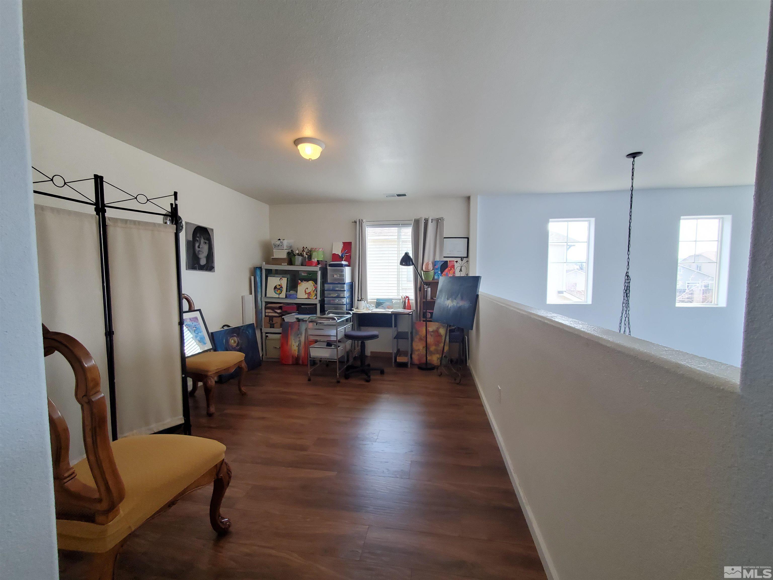 2275 Big Trail Circle Reno, NV 89521 - Photo 12 of 40 a living room with furniture and a wooden floor