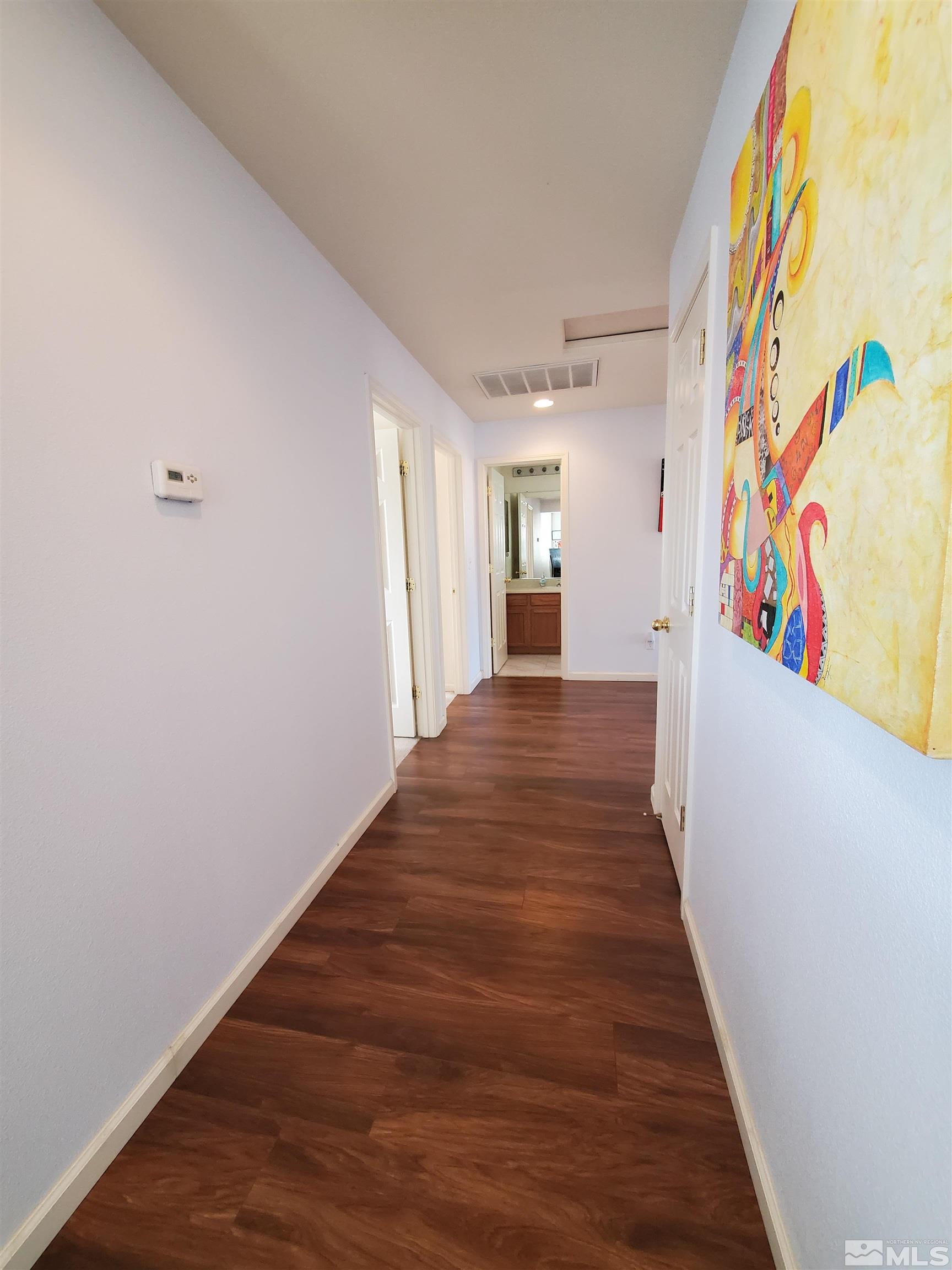2275 Big Trail Circle Reno, NV 89521 - Photo 16 of 40 a view of a hallway with wooden floor