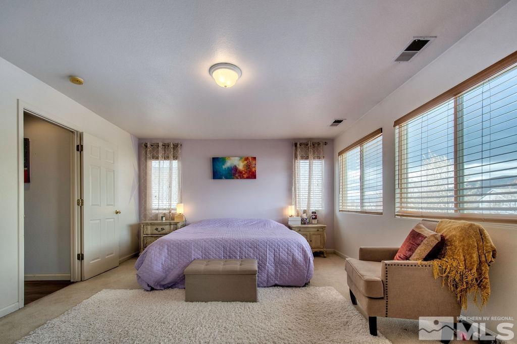 2275 Big Trail Circle Reno, NV 89521 - Photo 19 of 40 a bedroom with a bed and wooden floor