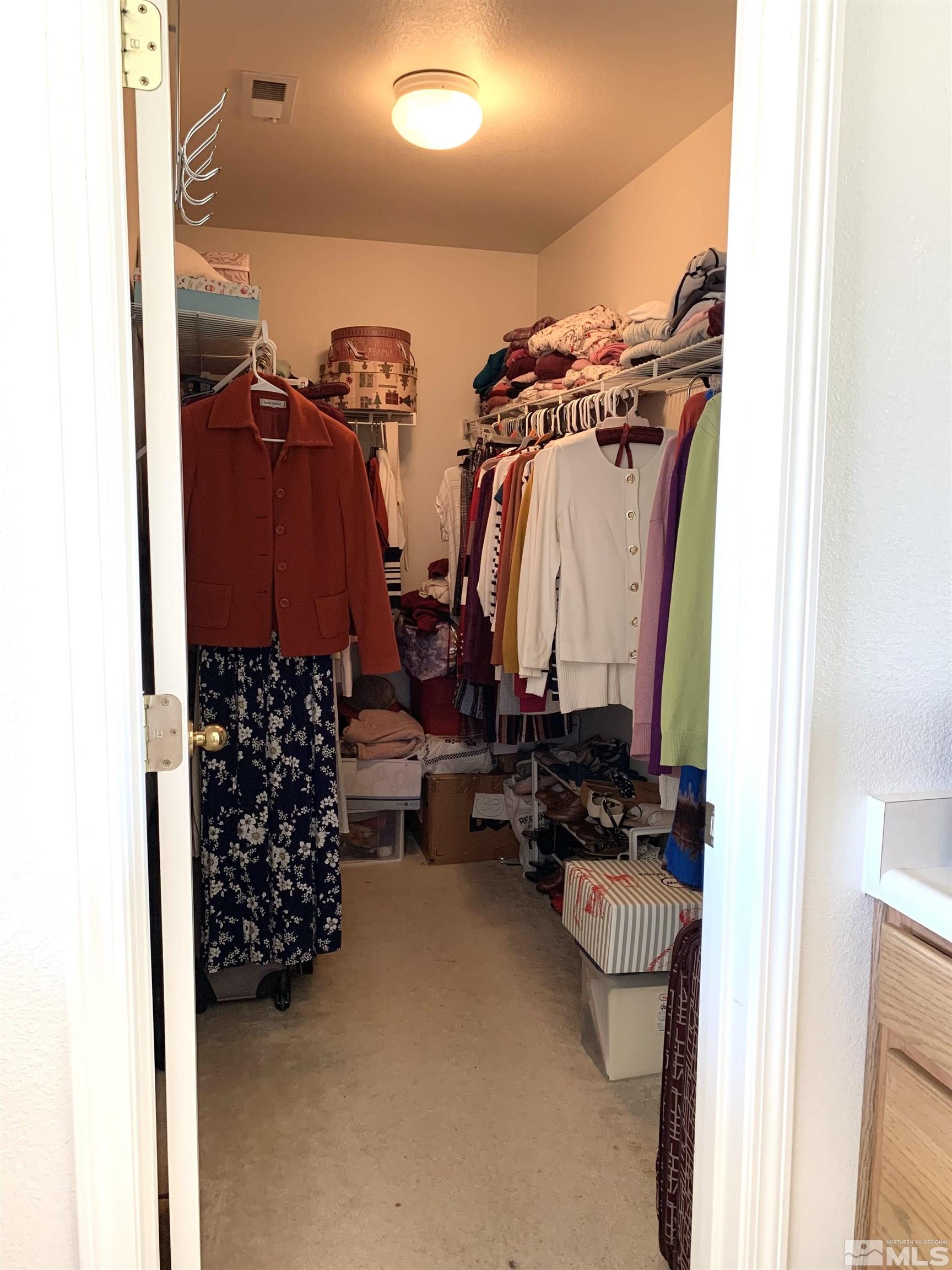 2275 Big Trail Circle Reno, NV 89521 - Photo 20 of 40 a view of walk in closet with clothes and shoes