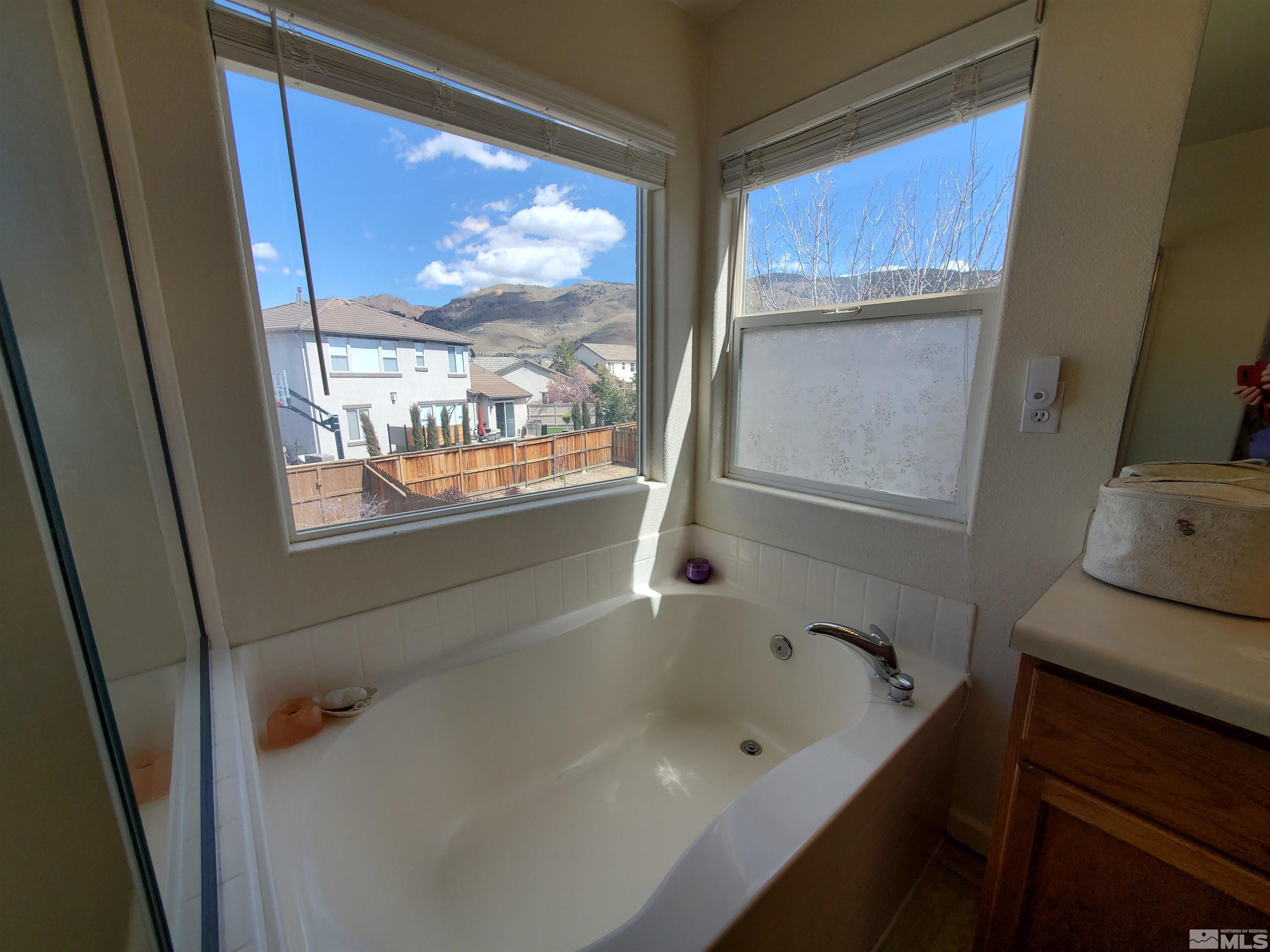2275 Big Trail Circle Reno, NV 89521 - Photo 21 of 40 a bathroom with a bathtub and a window