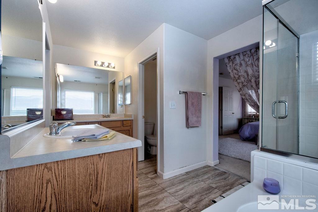 2275 Big Trail Circle Reno, NV 89521 - Photo 22 of 40 a bathroom with a sink mirror and a shower
