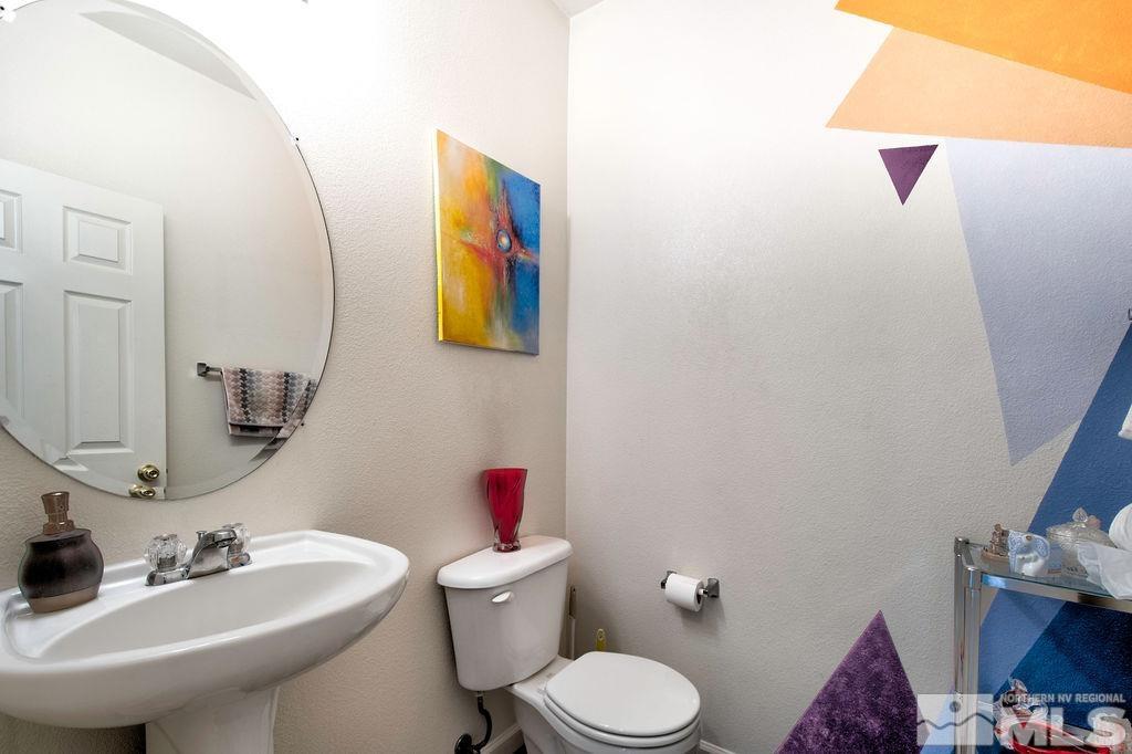 2275 Big Trail Circle Reno, NV 89521 - Photo 27 of 40 a bathroom with a toilet sink and mirror