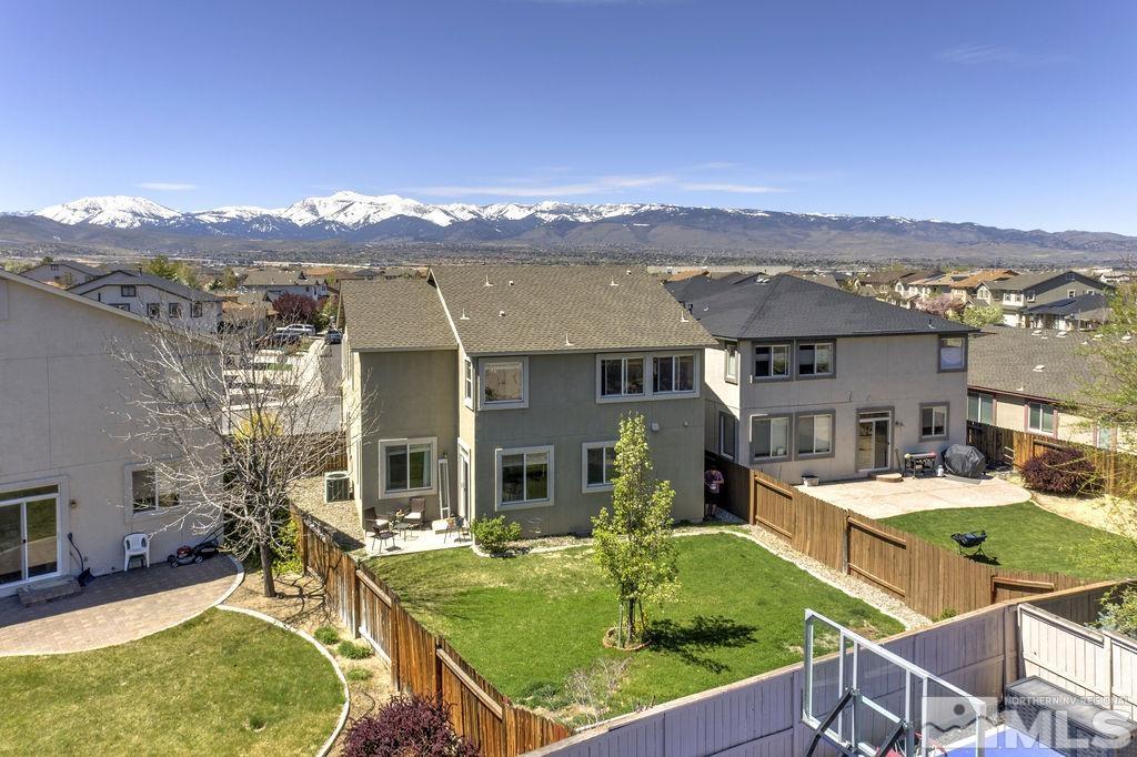 2275 Big Trail Circle Reno, NV 89521 - Photo 3 of 40 an aerial view of a house with swimming pool and mountain view