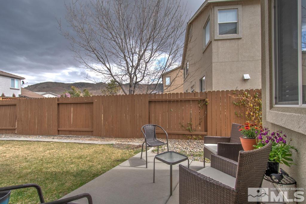 2275 Big Trail Circle Reno, NV 89521 - Photo 32 of 40 a backyard of a house with table and chairs