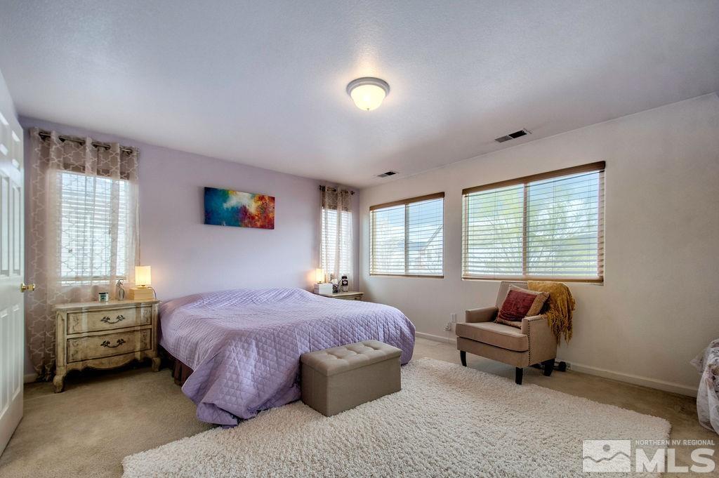 2275 Big Trail Circle Reno, NV 89521 - Photo 9 of 40 a spacious bedroom with a bed and a window
