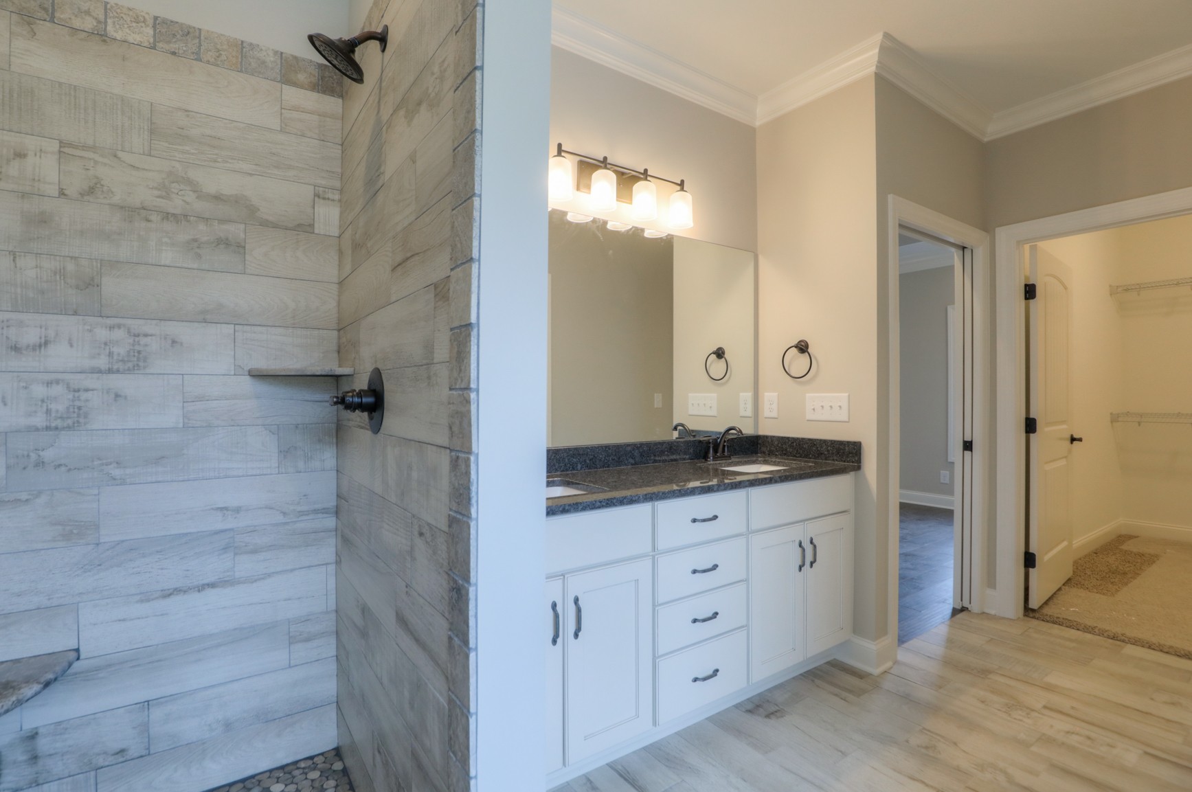 2351 Belotes Ferry Road Lebanon, TN 37087 - Photo 22 of 34 a bathroom with a granite countertop sink a mirror and a shower