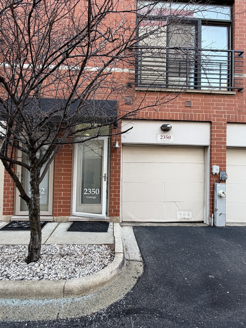 2350 West George Street, Unit 2350 Chicago, IL 60618 - Photo 2 of 21 a front view of a house with a yard