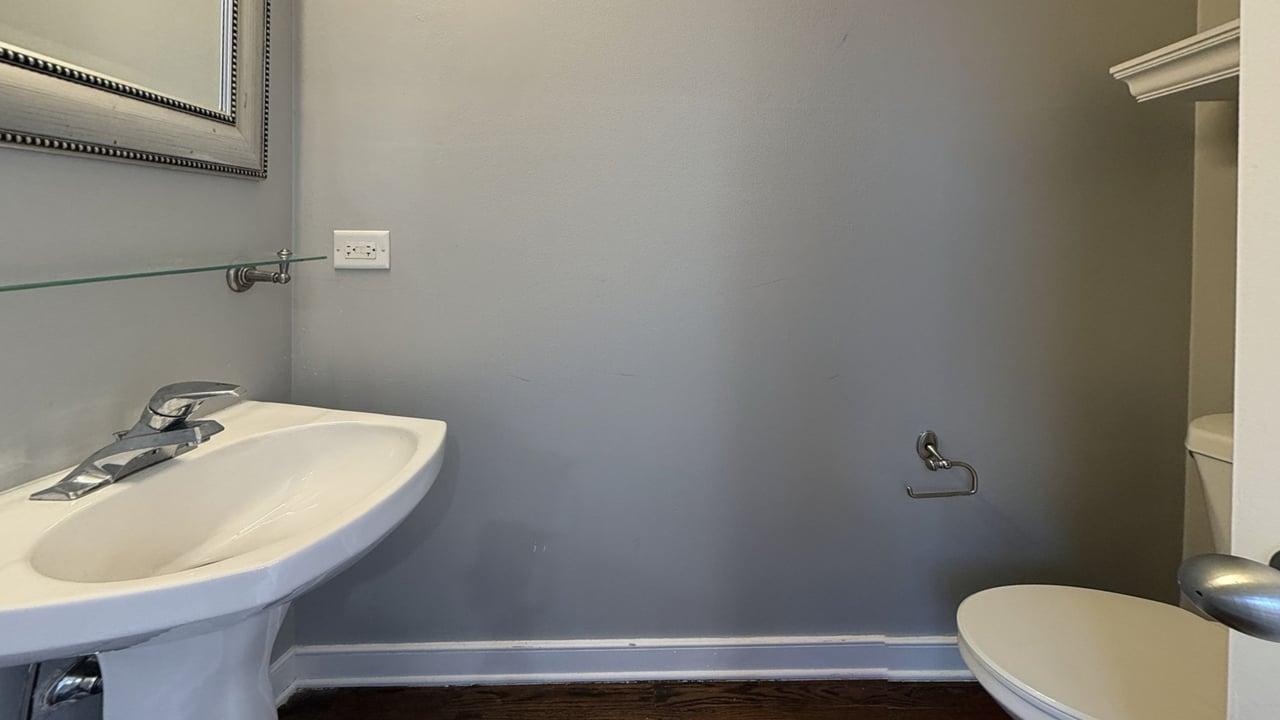 2350 West George Street, Unit 2350 Chicago, IL 60618 - Photo 6 of 21 a bathroom with a sink a toilet