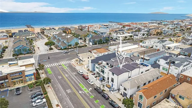 an aerial view of a city with ocean view