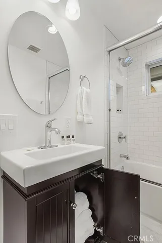 a bathroom with a sink double vanity and a mirror