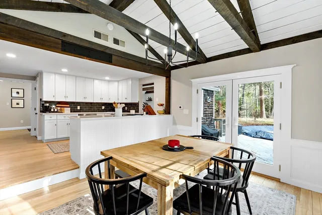 a spacious bathroom with a double vanity sink mirror and toilet