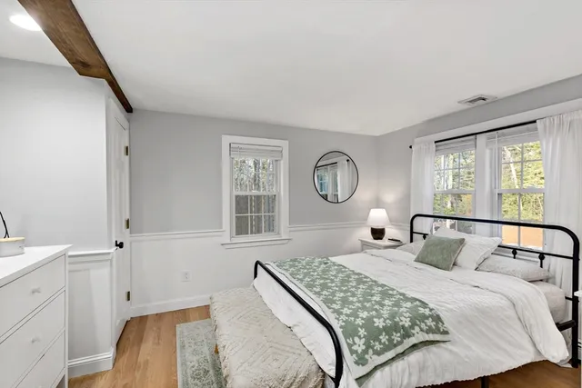 a bathroom with a window and a shower