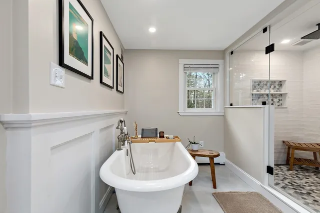 a bathroom with a sink a mirror and a window