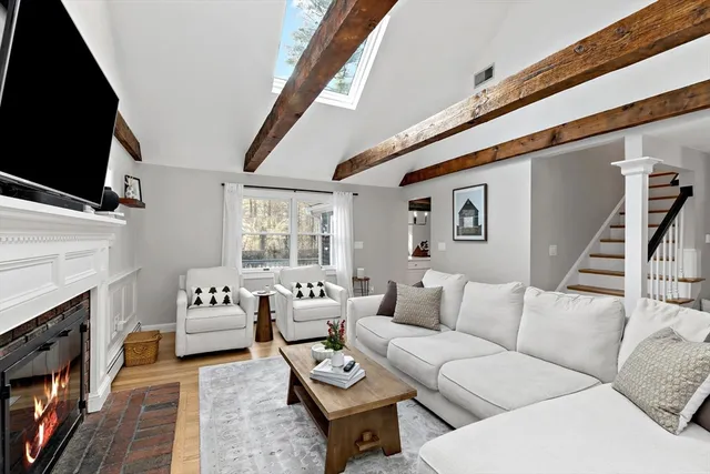 a kitchen with granite countertop a sink stove and cabinets