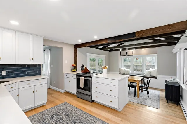 a kitchen with granite countertop a sink and cabinets
