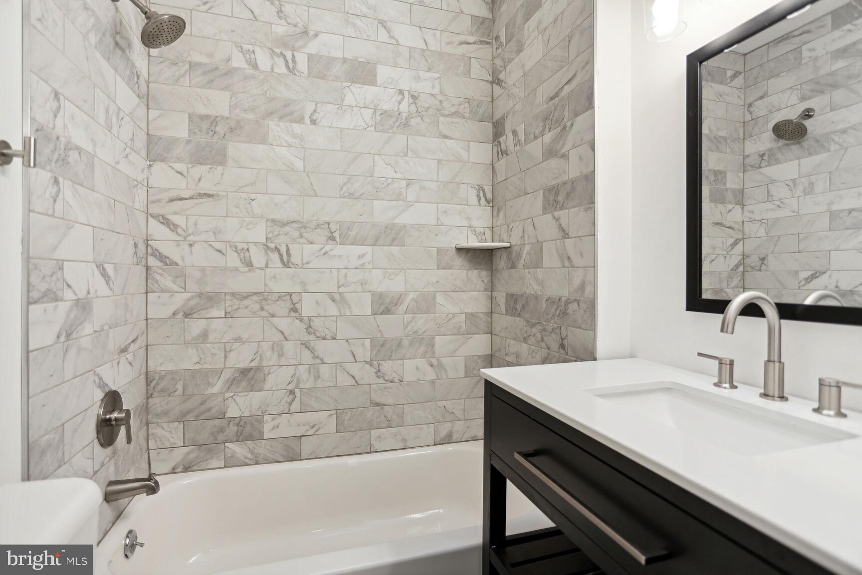 323 34th Street Northeast Washington, DC 20019 - Photo 16 of 28 a bathroom with a sink and a bathtub