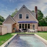 a view of a house with a backyard