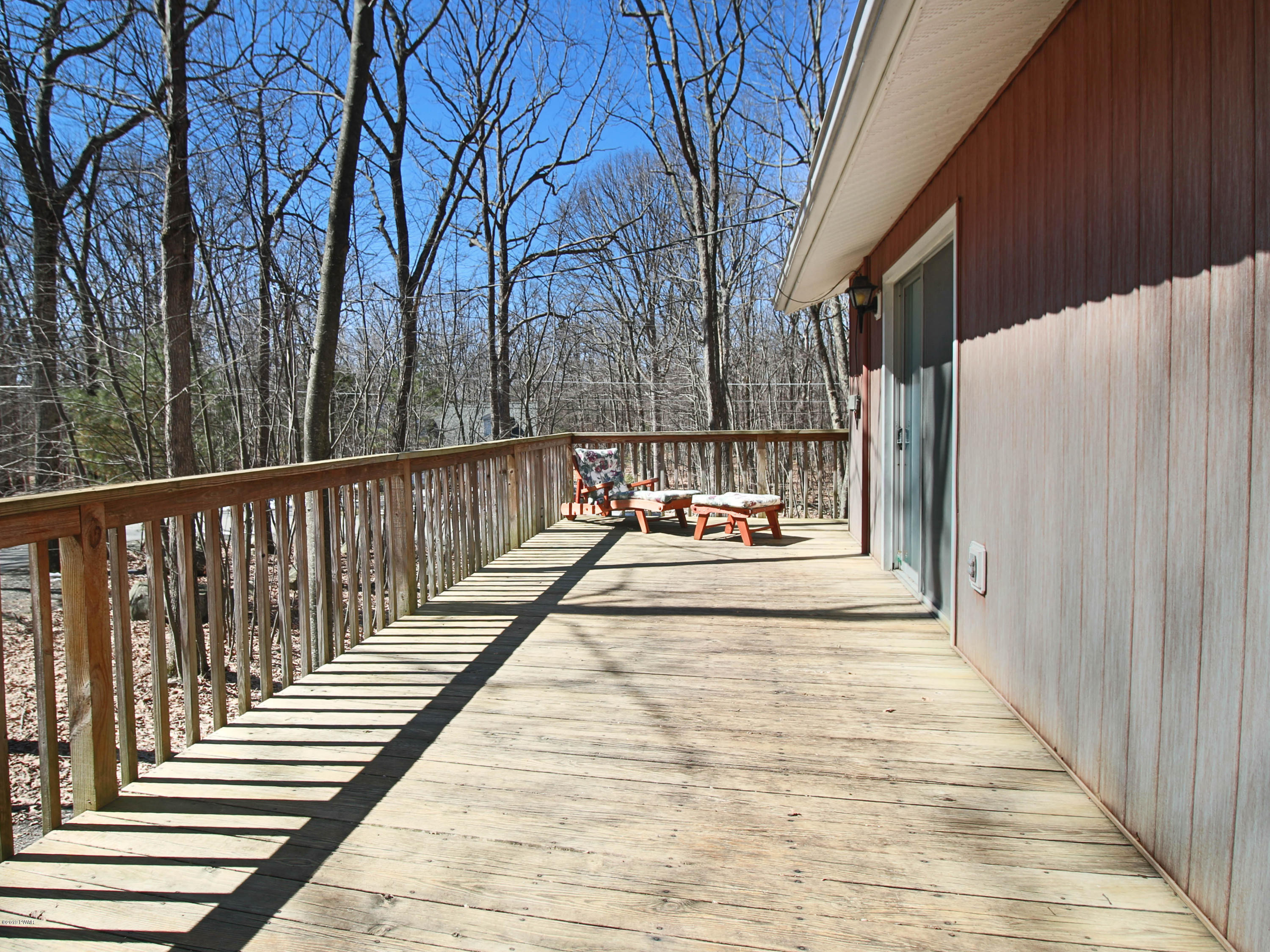 152 Butternut Road Milford, PA 18337 - Photo 5 of 27 a view of a house with backyard and trees