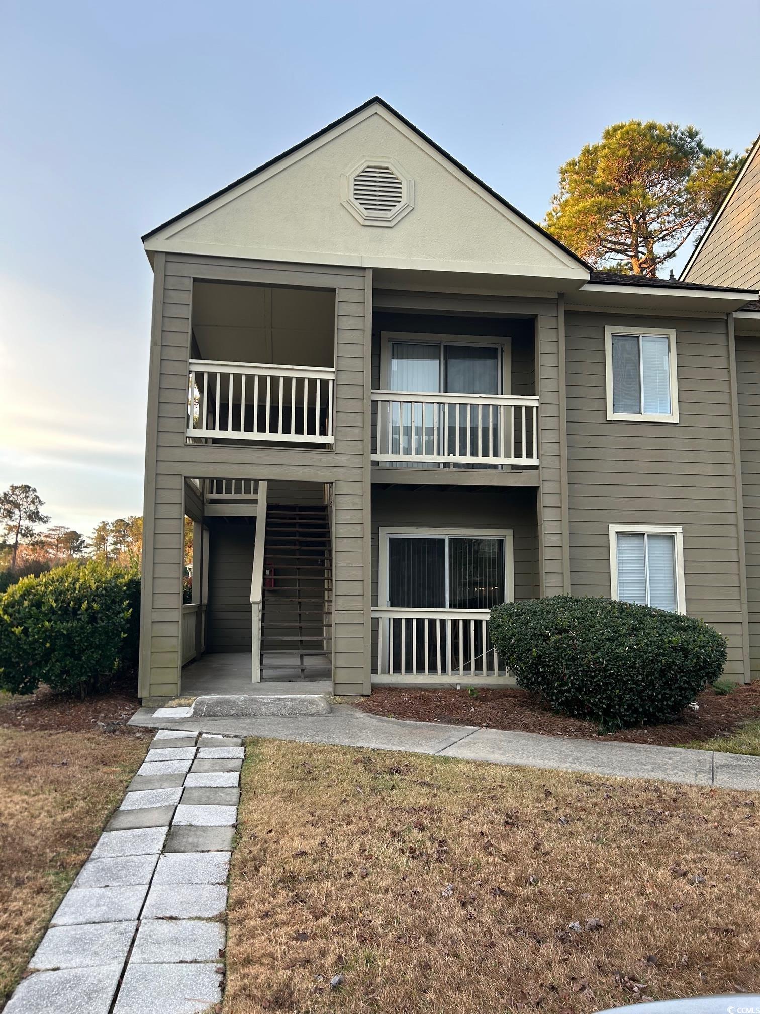 320 A Myrtle Greens Drive, Unit 320A Conway, SC 29526 - Photo 2 of 15 View of front of home with a balcony