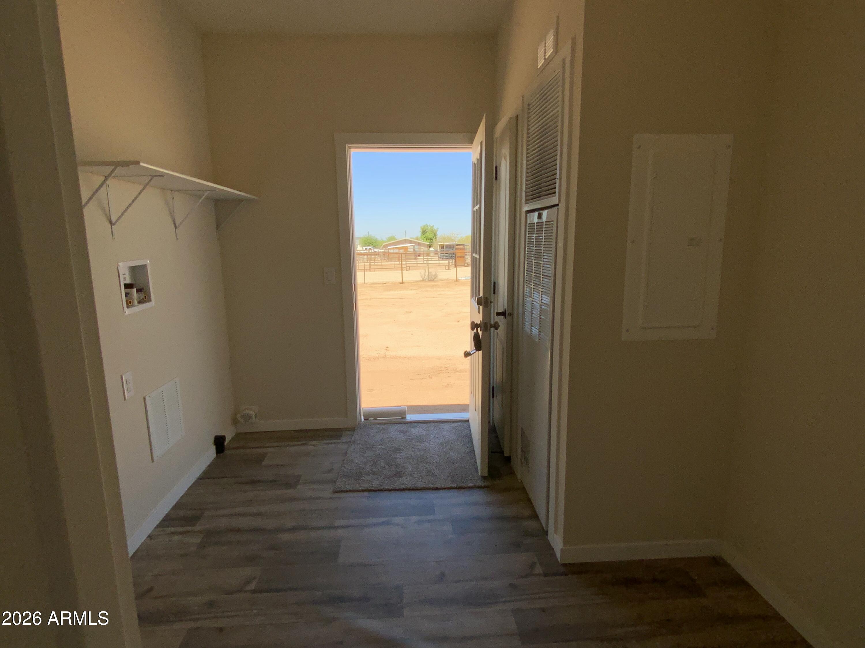 24046 East Cholla Road Florence, AZ 85132 - Photo 13 of 18 Large Storage Laundry Room with Exit