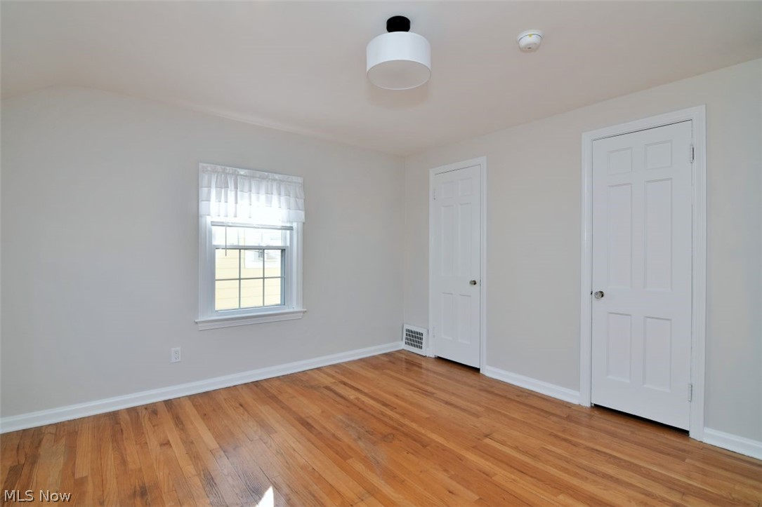 5284 Edenhurst Road Lyndhurst, OH 44124 - Photo 33 of 50 Hardwood flooring, light-colored walls, white trim, and a window with a white frame