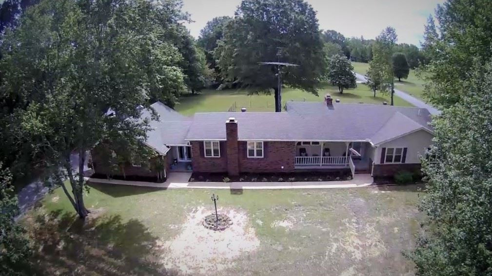 251 Crucifer Road Huron, TN 38345 - Photo 1 of 1 an aerial view of a house with swimming pool and a yard